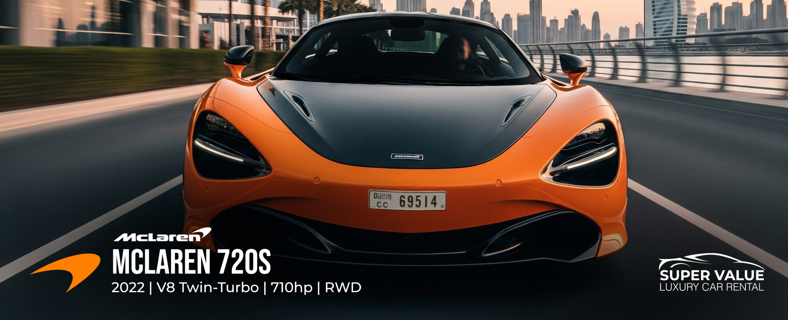 McLaren 720S 2022 orange rental in Dubai with dihedral doors open